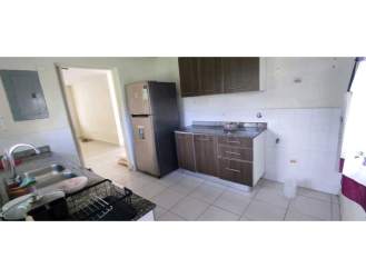 Modern kitchen brown cabinets, fridge space, double sink Playa Dorada house rental