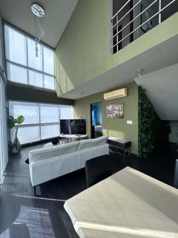 Modern kitchen with granite countertops, wood cabinets in PH Park Loft Via Porras