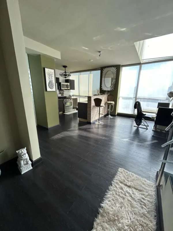 Modern bedroom with large windows and AC at PH Park Loft San Francisco Panama