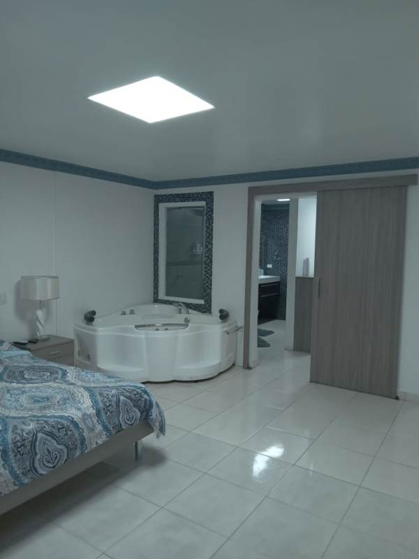Modern walk-in closet and ensuite bathroom in luxury house Condado del Rey Panama