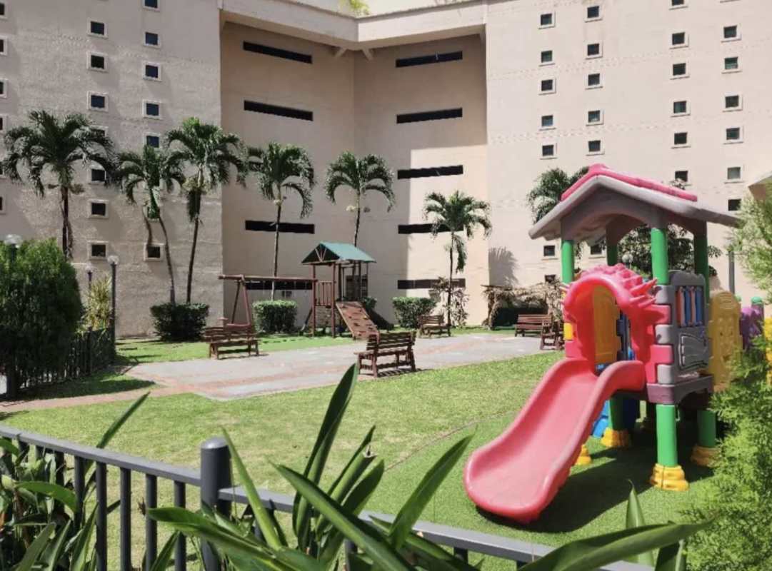 Living dining area with glass door access to balcony in PH Pacific Wind Panama