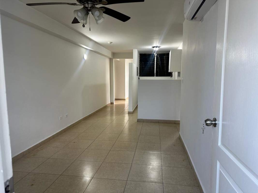 Bright living room with ceramic tile floor and large window at PH Bella Vista Garden
