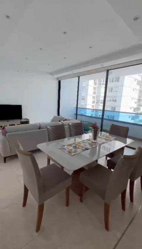 Elegant dining area with floor-to-ceiling panoramic windows ocean view PH Deluxe Paitilla