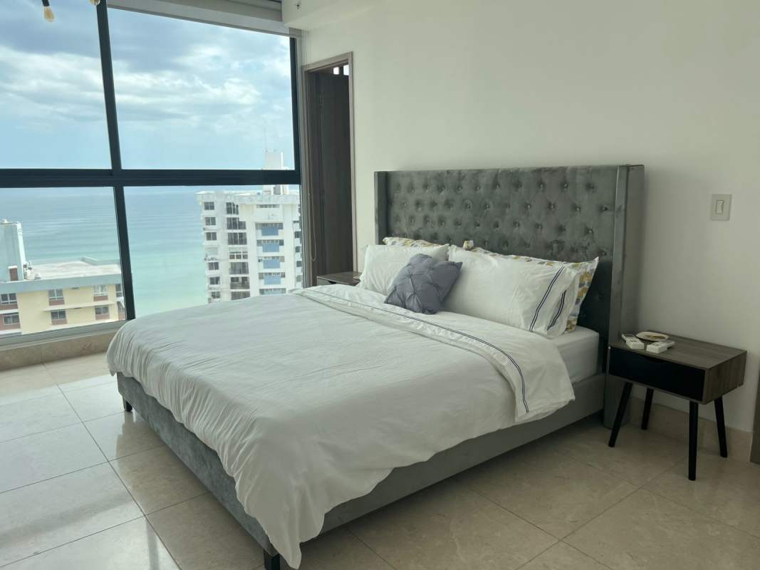 Fully equipped kitchen with black granite countertops and appliances in Punta Paitilla apartment