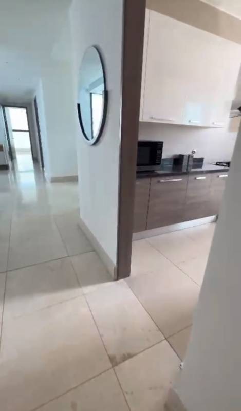 Bedroom furnished with large window ocean views in PH Deluxe Punta Paitilla rental apartment