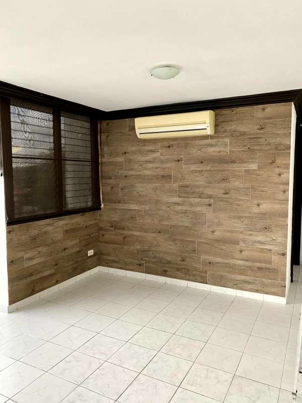 Modern bathroom with glass shower enclosure and tiled walls El Dorado Panama