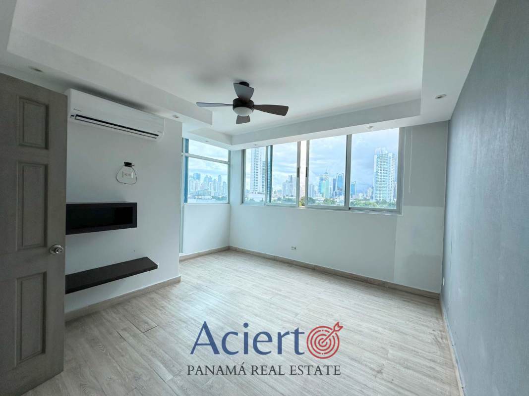 Spacious walk-in closet wood shelving at PH San Francisco Diamond Tower Panama