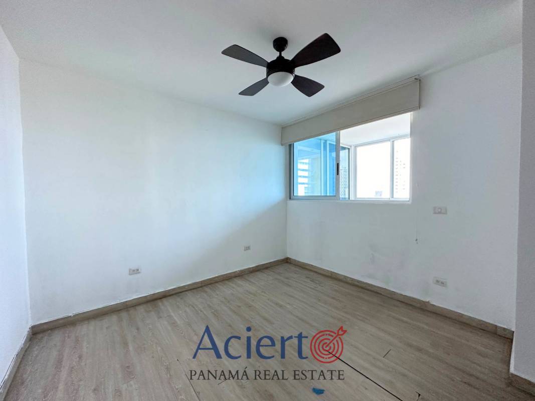 Empty bright bedroom with wood tile floors, fan in PH San Francisco Diamond Tower