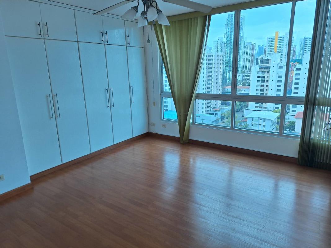 Master bedroom with wood floors and closet space in PH Premium Point San Francisco rental