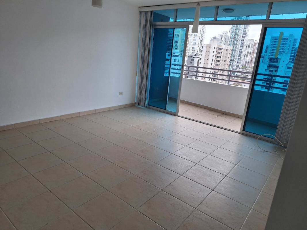 Modern living room with large glass doors opening to balcony PH Premium Point Panama