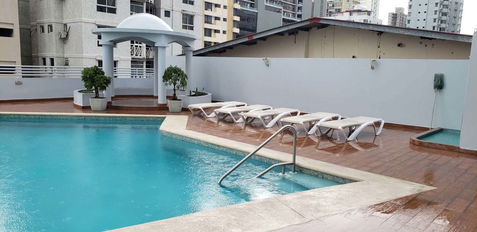 Outdoor pool area with white gazebo and city views PH Premium Point Panama