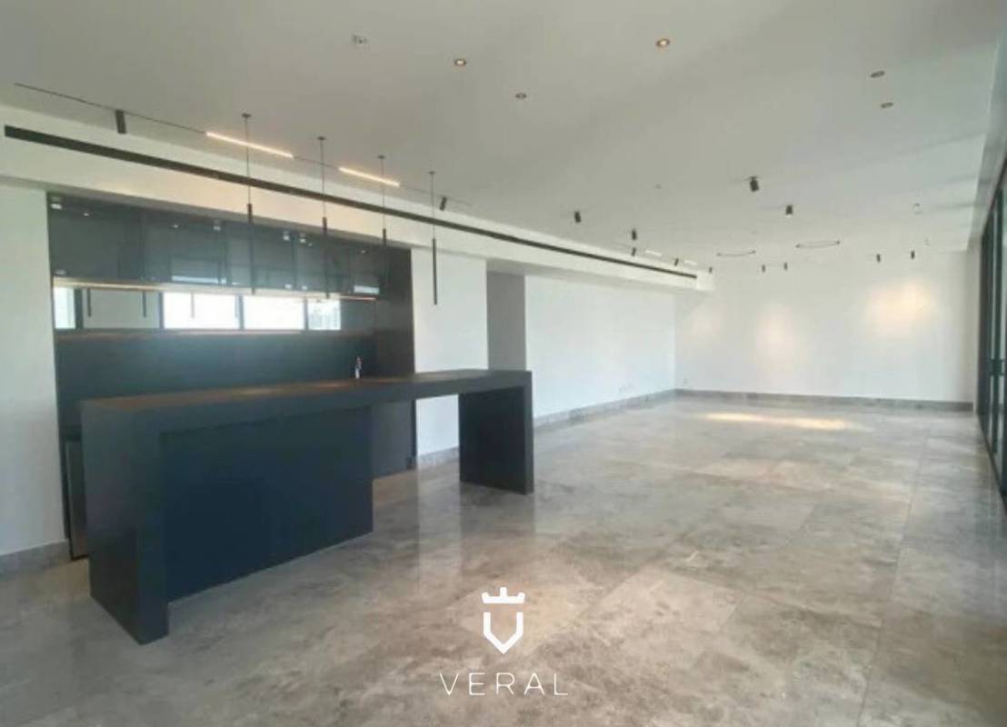 Contemporary open plan space with marble flooring and large windows in Empire Residences Panama