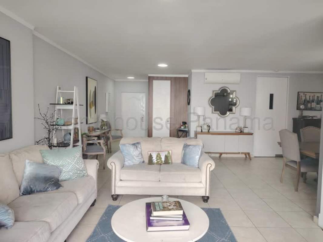 Master bedroom with ocean views, dark accent wall, desk area and AC PH Pacific Point Panama City apartment