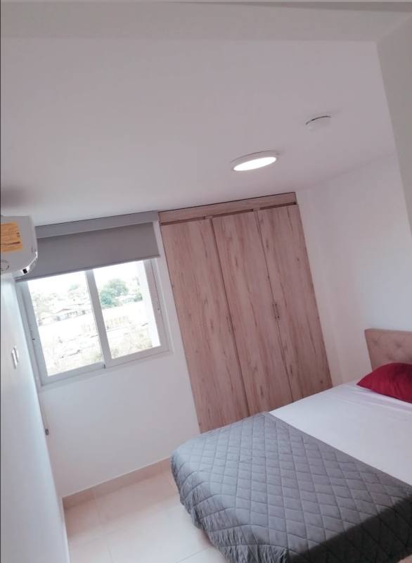 Second bedroom with wardrobe AC roller blinds minimalist style Panama Viejo Residences Panama