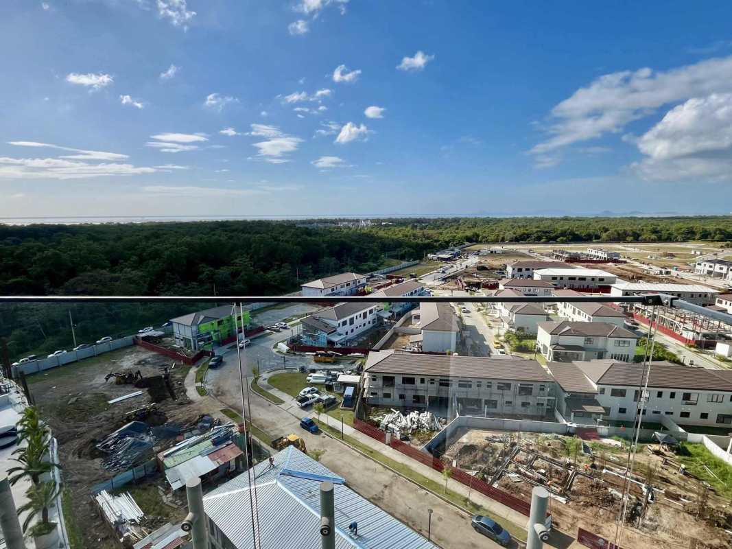 View from balcony over lush residential community Santa Maria and skyline from Ocean House apartment Panama