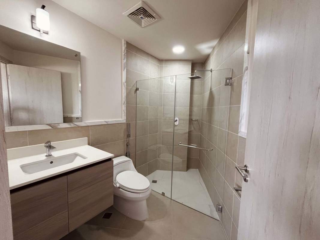 Modern bathroom featuring glass shower and vanity in Ocean House Santa Maria Panama rental apartment