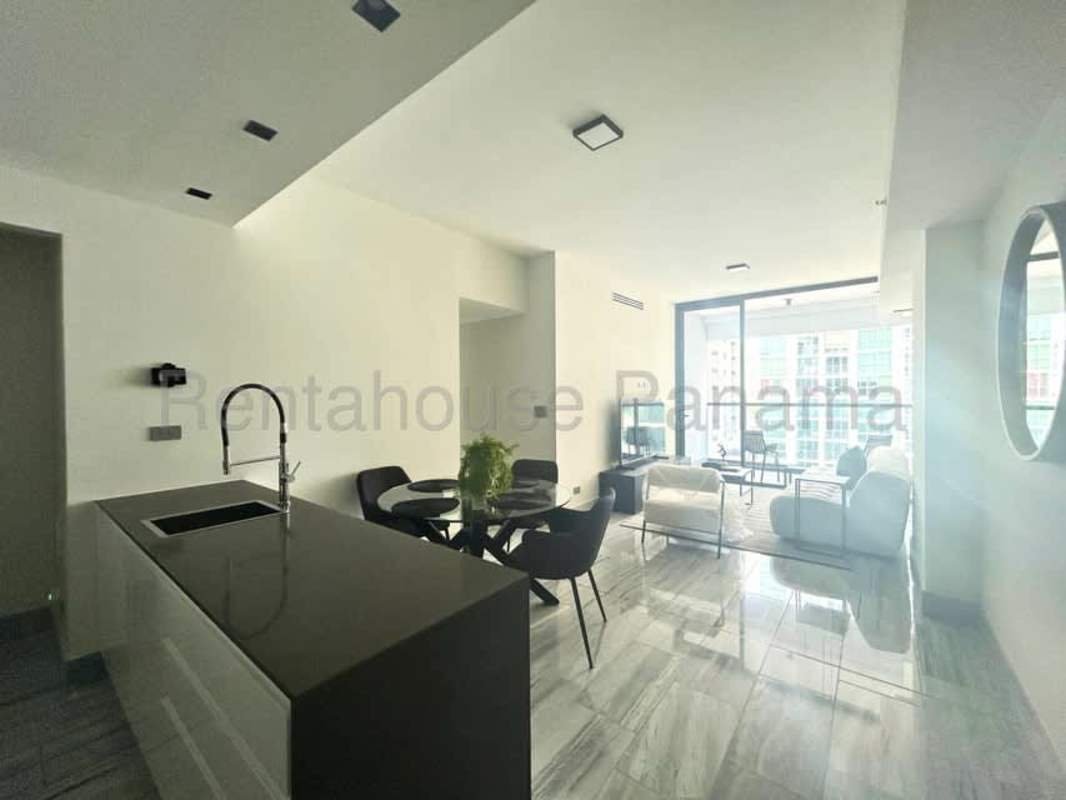 Bright living room with floor to ceiling windows, ocean view furnishings Nuovo by Armani Casa Panama