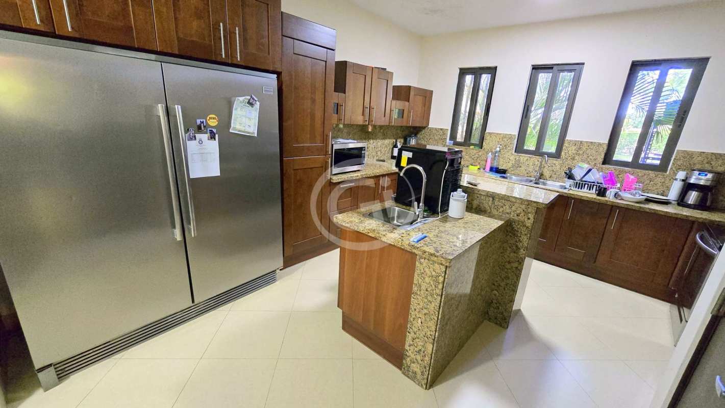 Contemporary kitchen with granite countertops, wood cabinets, stainless appliances Embassy Club Clayton