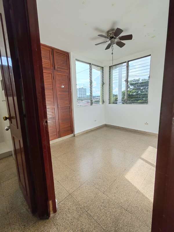 Bedroom with ceiling fan, built-in closet, tiled floor PH Don David Panama