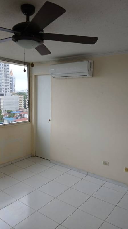 Bright unfurnished bedroom with AC, fan and large window in PH Vista Hermosa Tower El Cangrejo