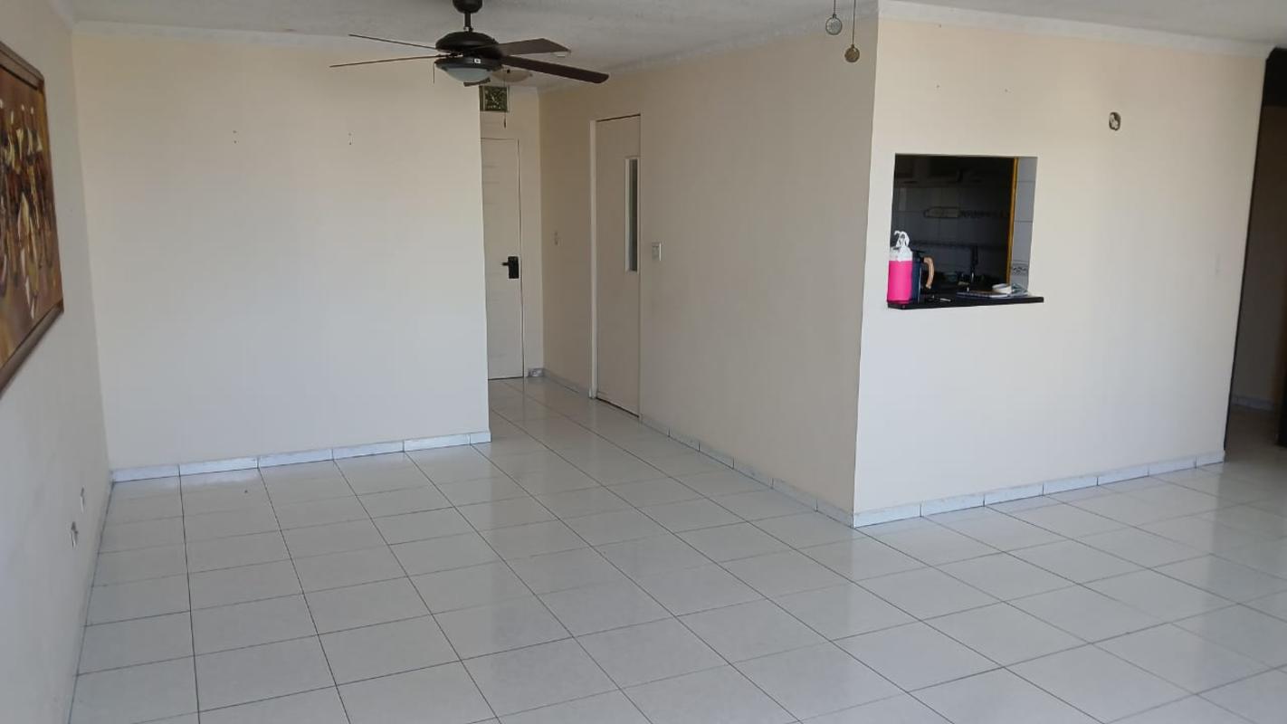 Spacious living room with balcony access, ceiling fans, and natural light El Cangrejo