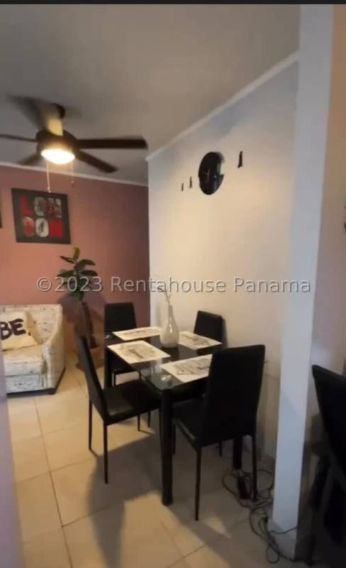 Apartment entrance with modern white door pink walls and tiled floor Mystic Tower Panama