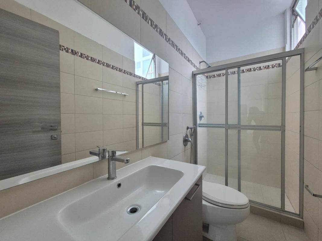 Modern bathroom featuring glass shower enclosure and stylish tile PH Latorraca Panama