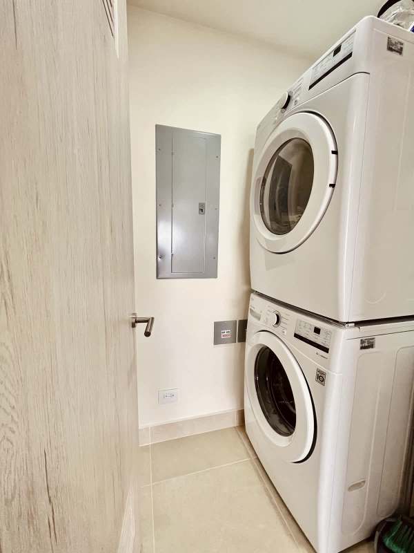 Laundry room with washer/dryer connections and storage space at Ocean House Santa Maria Panama