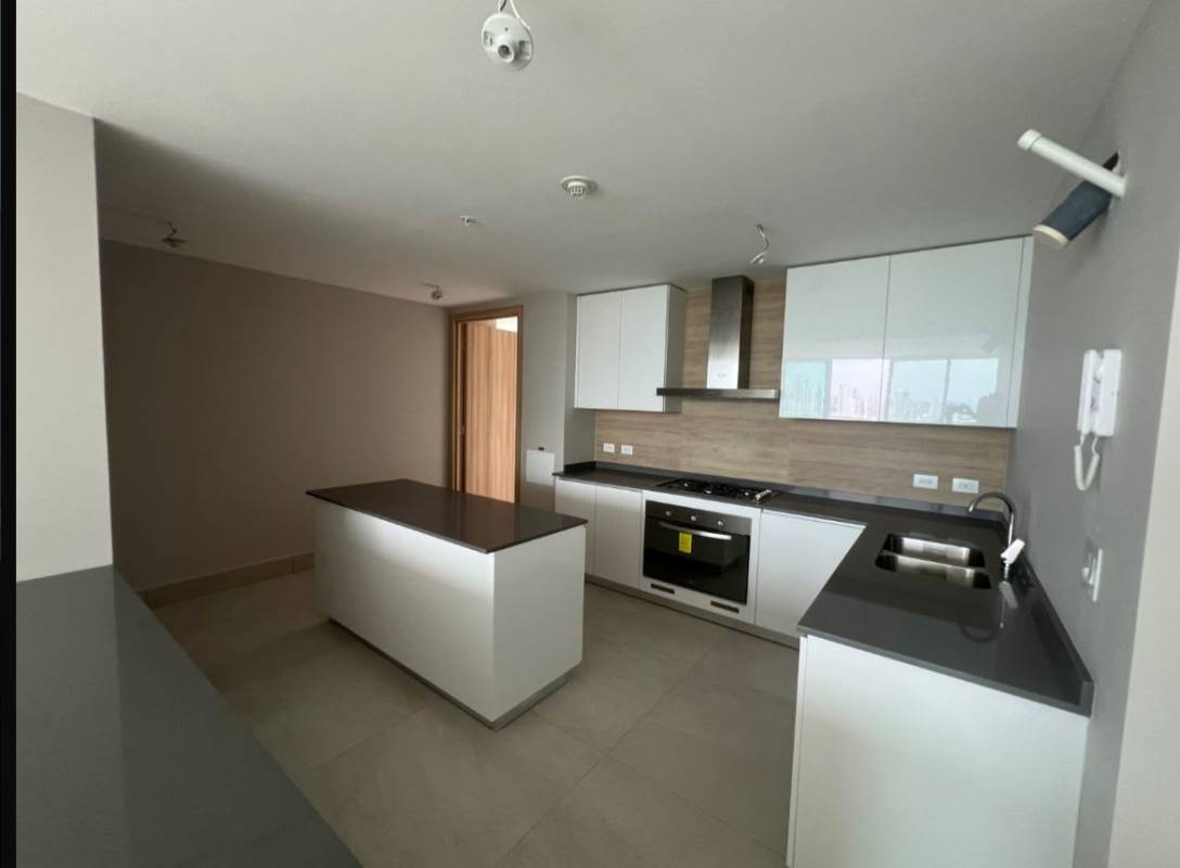 Contemporary kitchen white cabinetry built-in appliances at PH Coco del Mar Panama