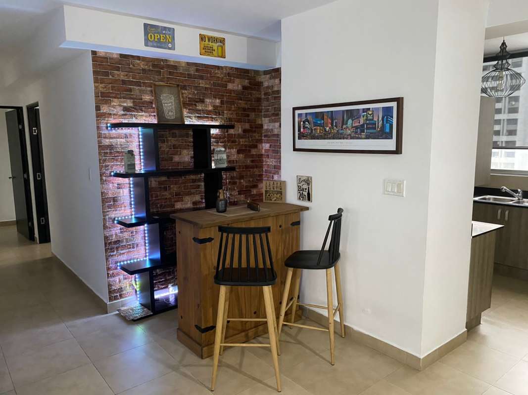 Bright living and dining space with modern decor, city views at PH The One Tower Panama City