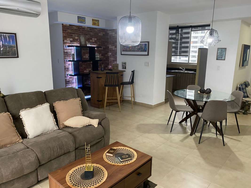 Contemporary kitchen with granite countertops, appliances and ample storage at PH The One Tower Panama City