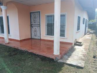 Simple bedroom with tiled floor in El Paraiso David house