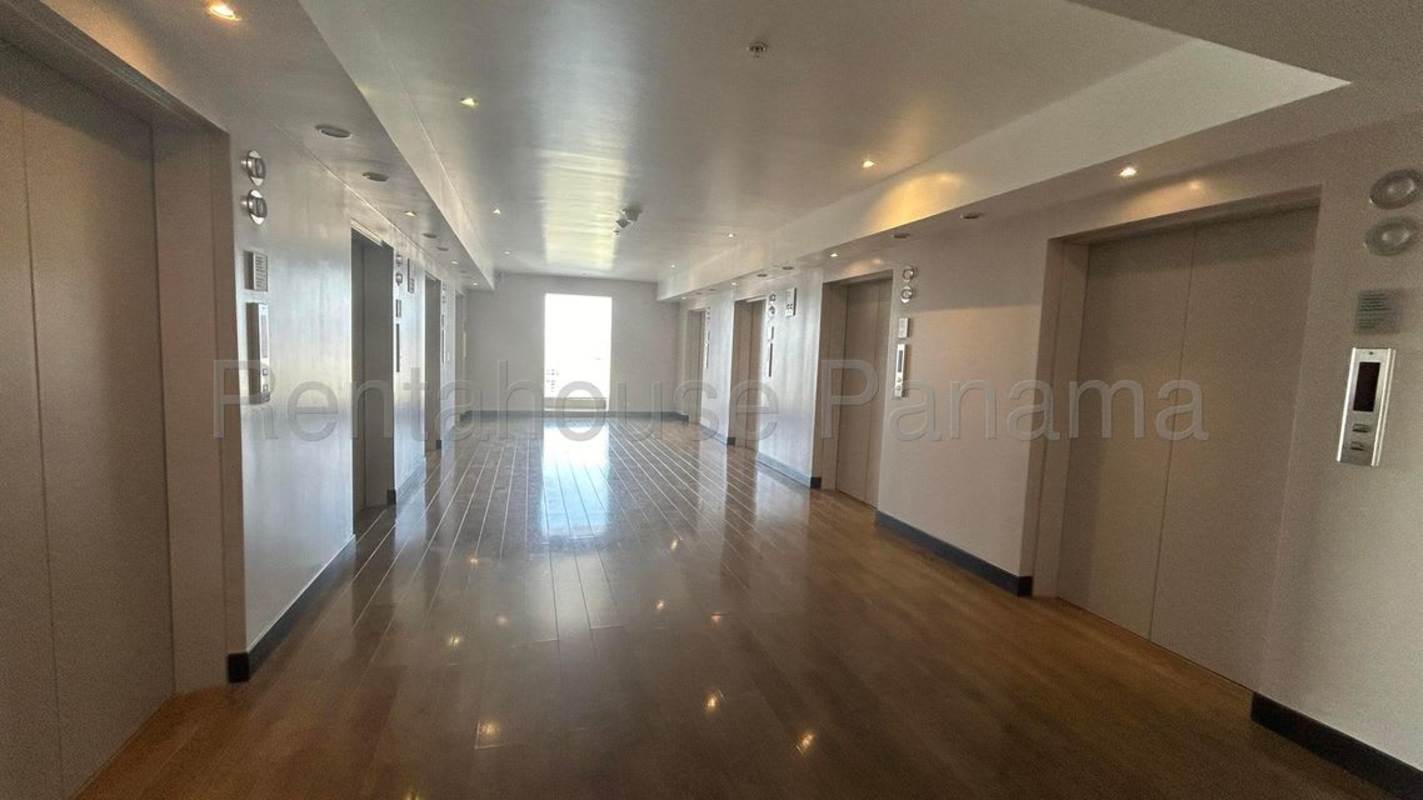Modern bathroom with marble double sink vanity, glass shower in Punta Pacifica condo Panama
