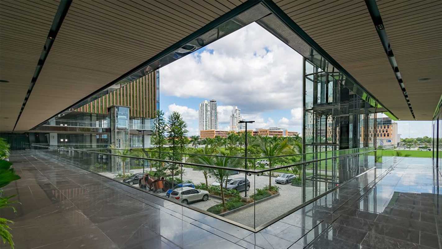 Interior hallway with full glass window city view in Panama Design Center Costa del Este Panama