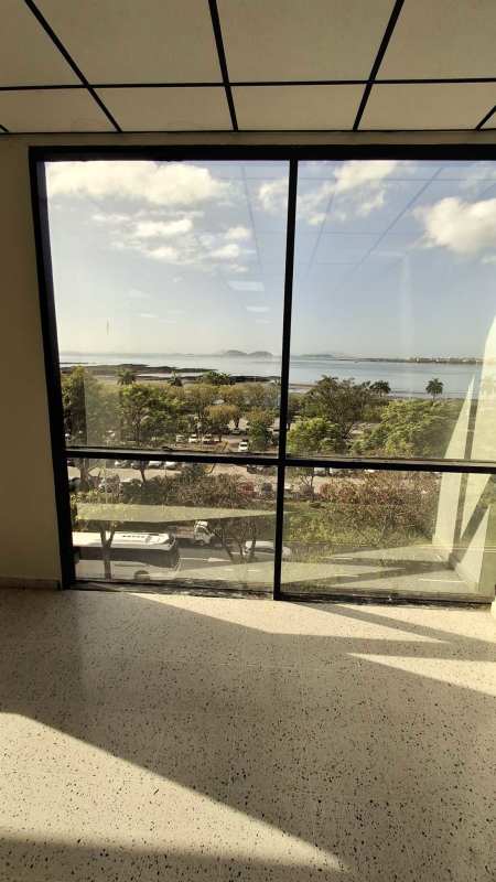 Large windows in office overlooking Panama City skyline ocean Bahía Balboa Plaza