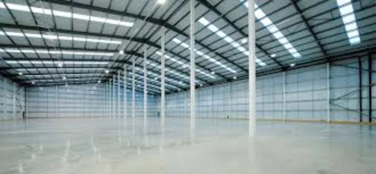 Warehouse main facade with docking bays and ramps Terminal Industrial Zona Uno Panama