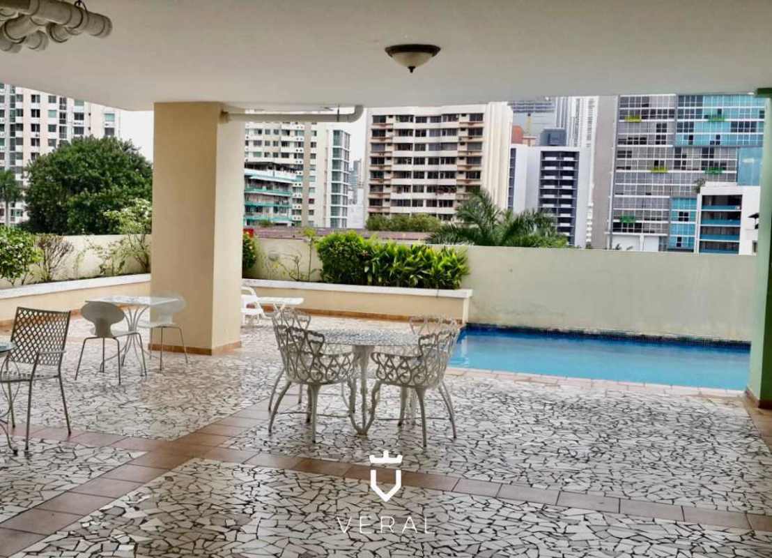 Living room with access to balcony and city view at PH Plaza 77 Via Argentina Panama