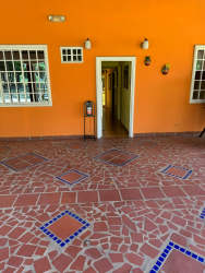 Mediterranean style covered patio with arches and terracotta floor at Río Hato farm