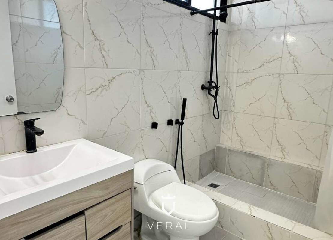 Newly remodeled modern bathroom marble tile at PH Vista Tower Panama Marbella