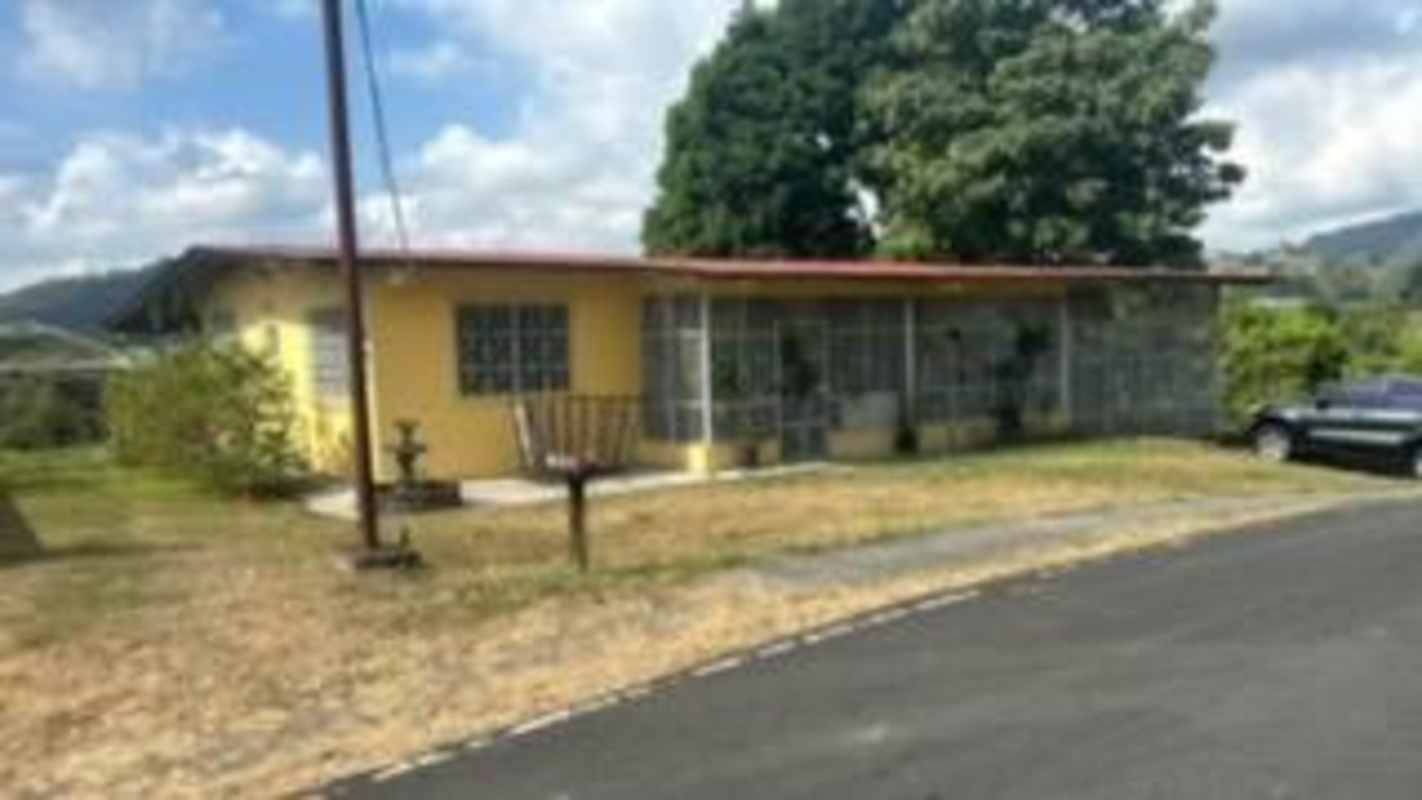 Exterior single-level house with metal bars and yard in Las Cumbres Panama