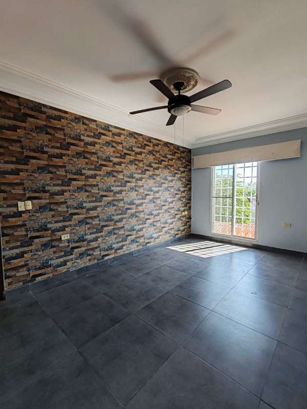 Master bedroom ample space tile floor ceiling fan walk-in closet Villa Zaita