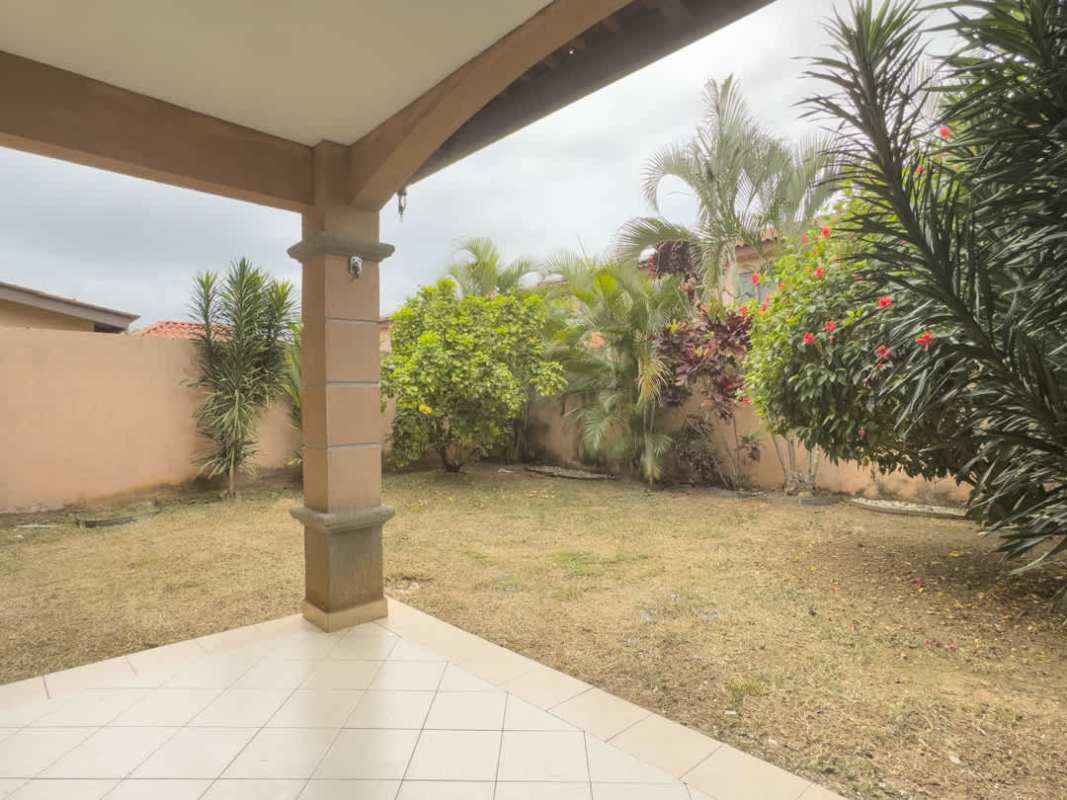 Covered patio overlooking private fenced garden in Versalles Costa Sur Panama house rental