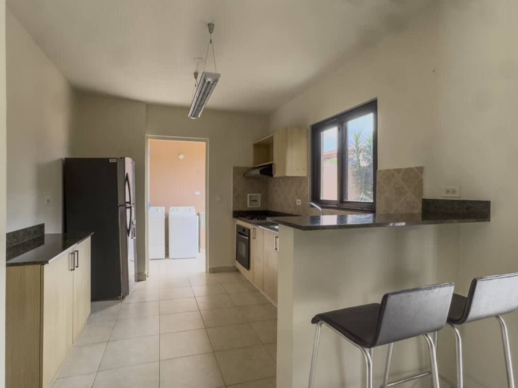 Spacious living and dining open space with tiled floors overlooking private garden in Versalles Costa Sur Panama