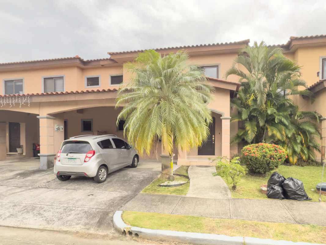 Open kitchen with granite counters and breakfast bar at family house Versalles Costa Sur Panama