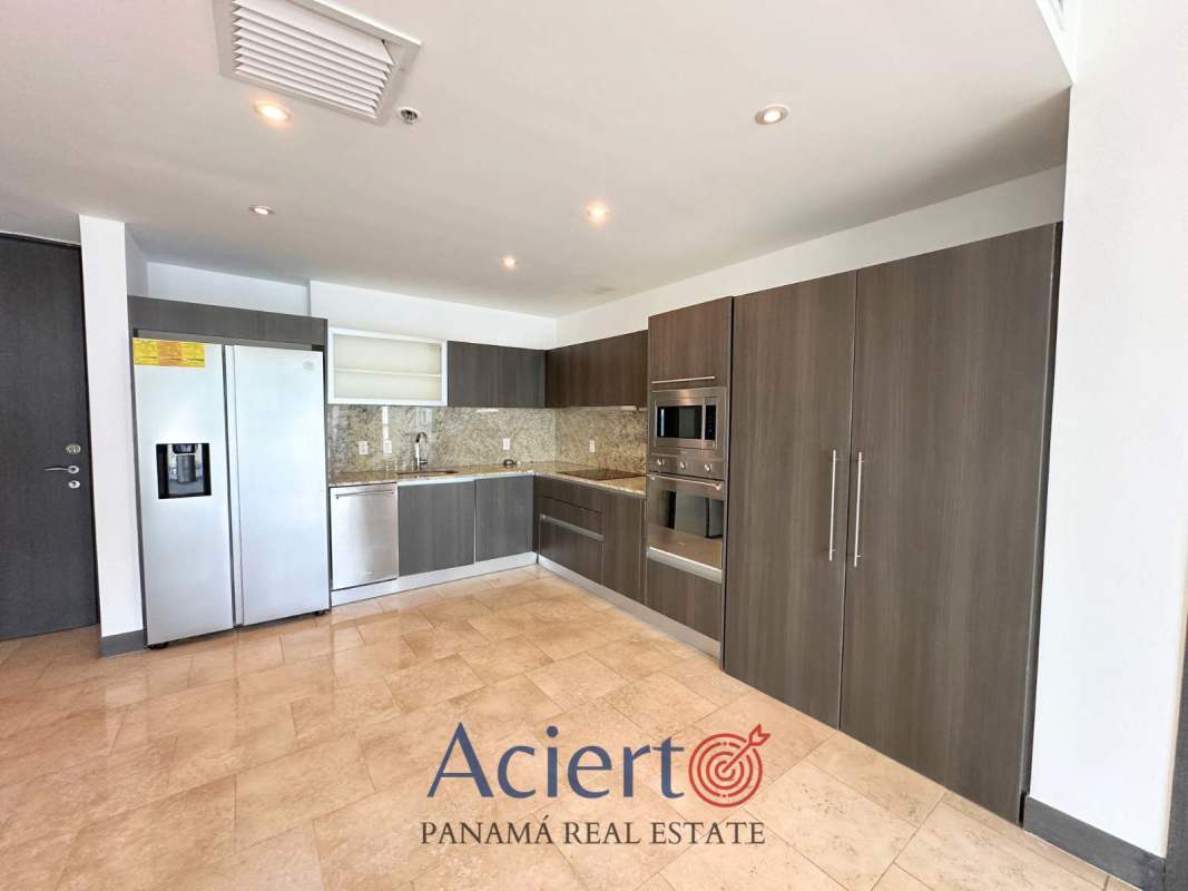 Contemporary kitchen with granite countertops and stainless steel appliances in JW Marriott Panama luxury condo Punta Pacífica