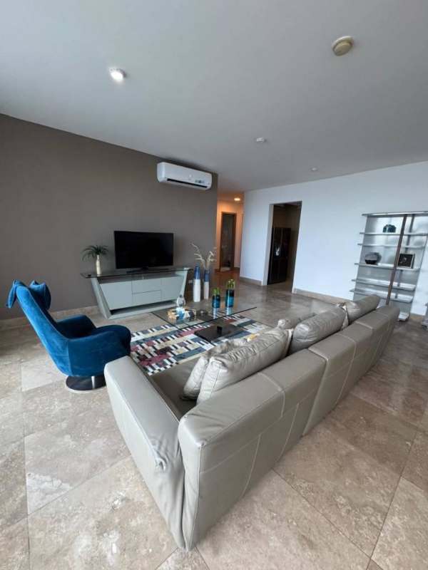 Living area with full-height glass and sea views in luxury apartment Punta Pacifica PH Q Tower