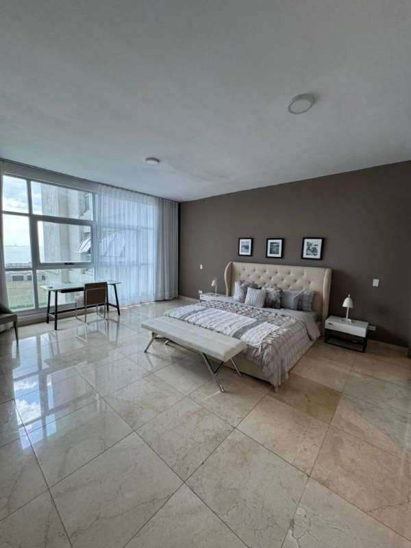 Bedroom with big windows city and partial sea view in Punta Pacifica apartment for rent