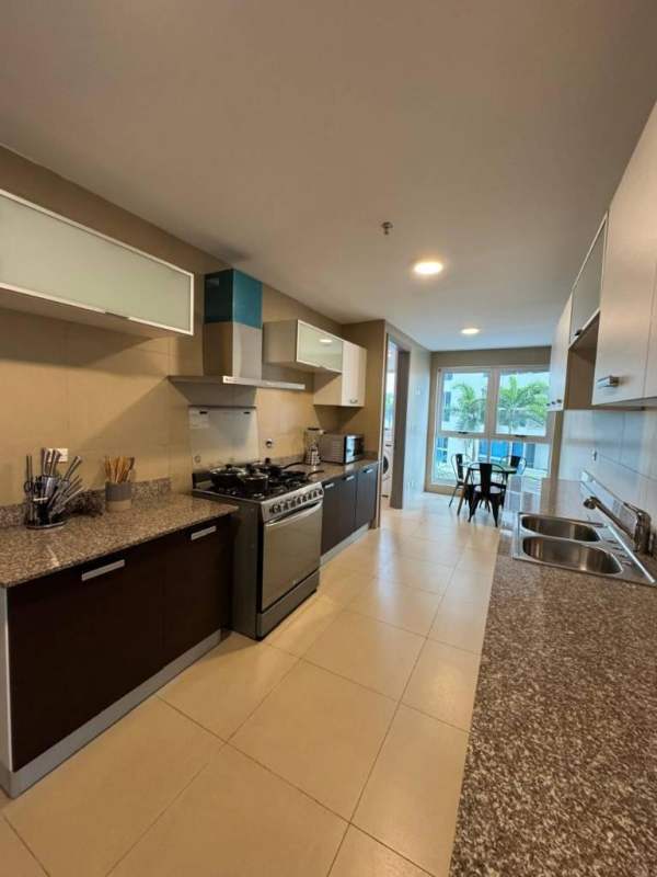 Apartment kitchen with granite countertops and stainless steel stove PH Q Tower Punta Pacifica rental