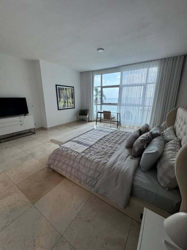 Spacious bedroom with floor-to-ceiling window and Pacific Ocean views Punta Pacifica