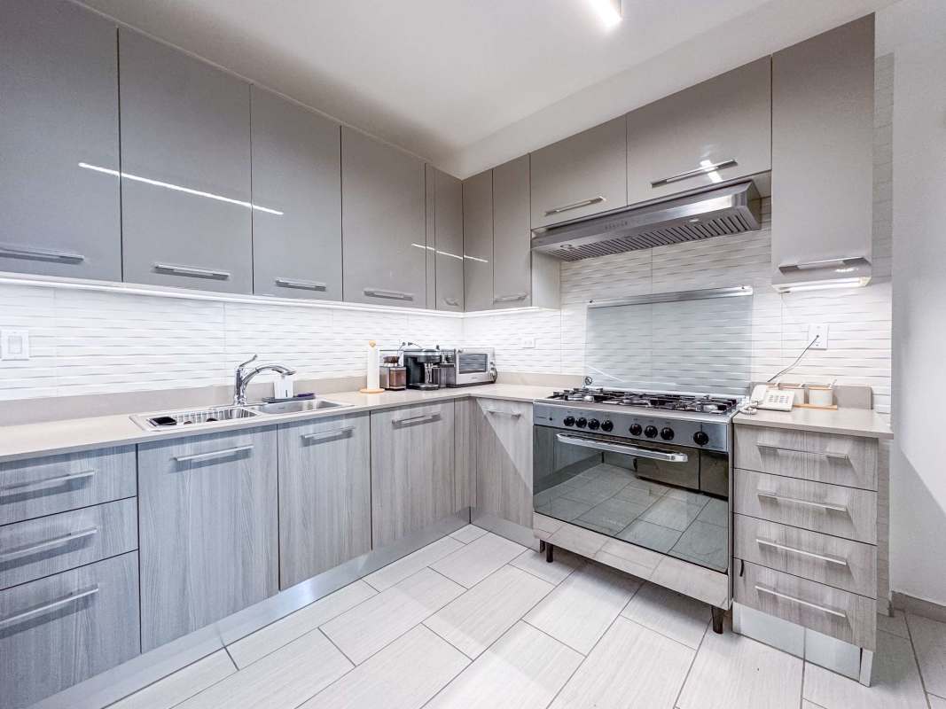 Laundry area equipped with washer and dryer in luxury apartment The Towers Punta Pacifica